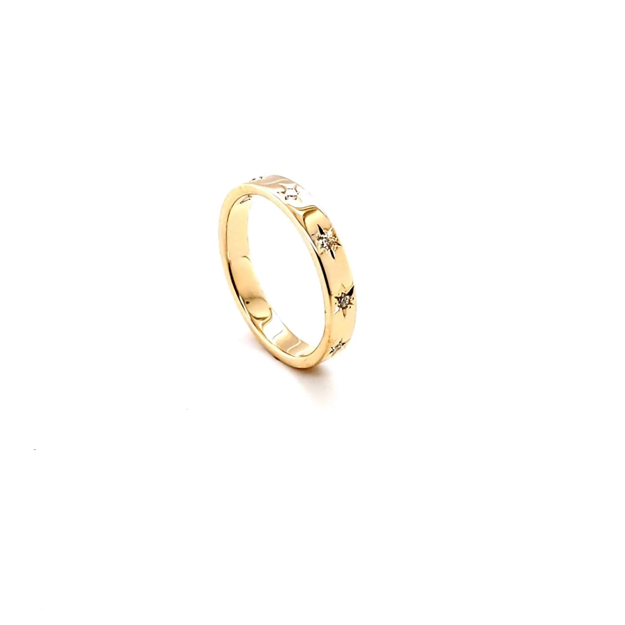 18K yellow gold Solace Band with starburst design and blue sapphires, celestial-inspired ring