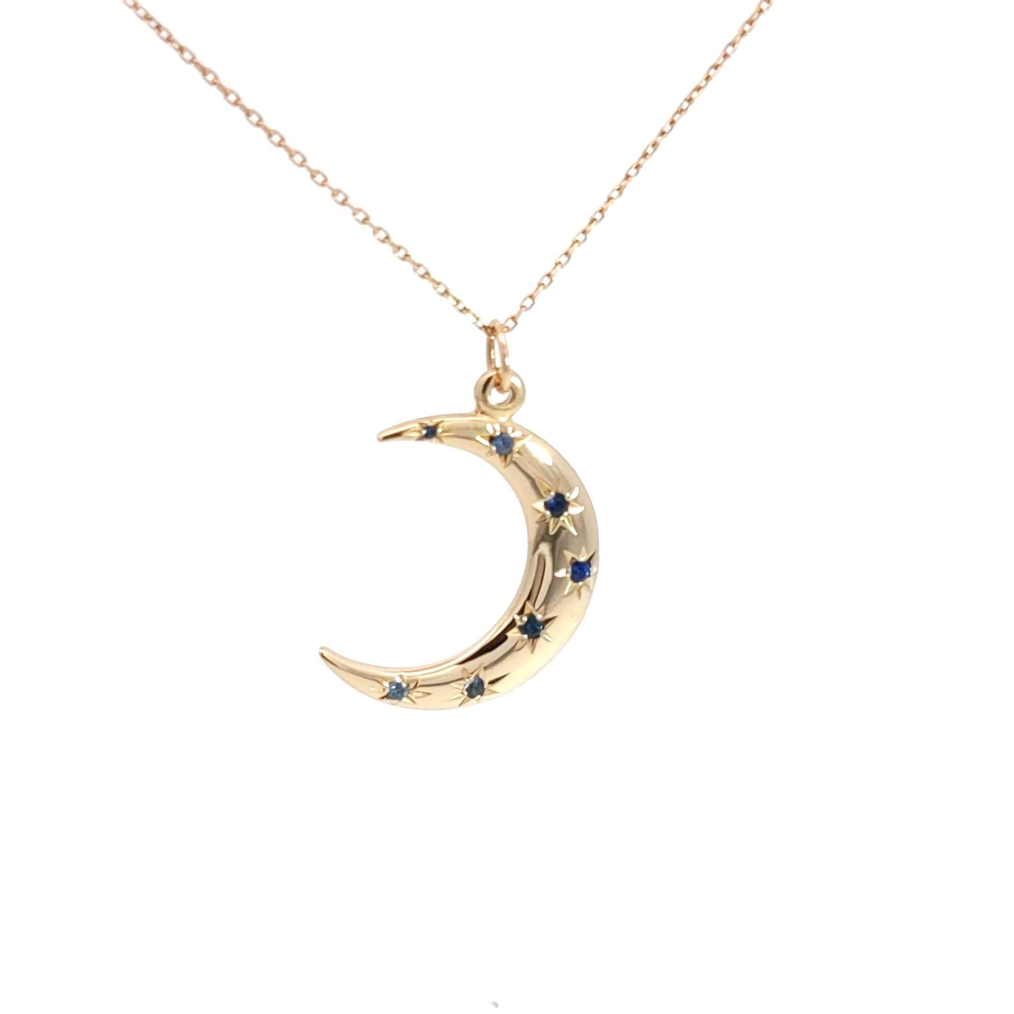 14K gold crescent moon necklace with sapphire starburst design on 18-inch cable chain