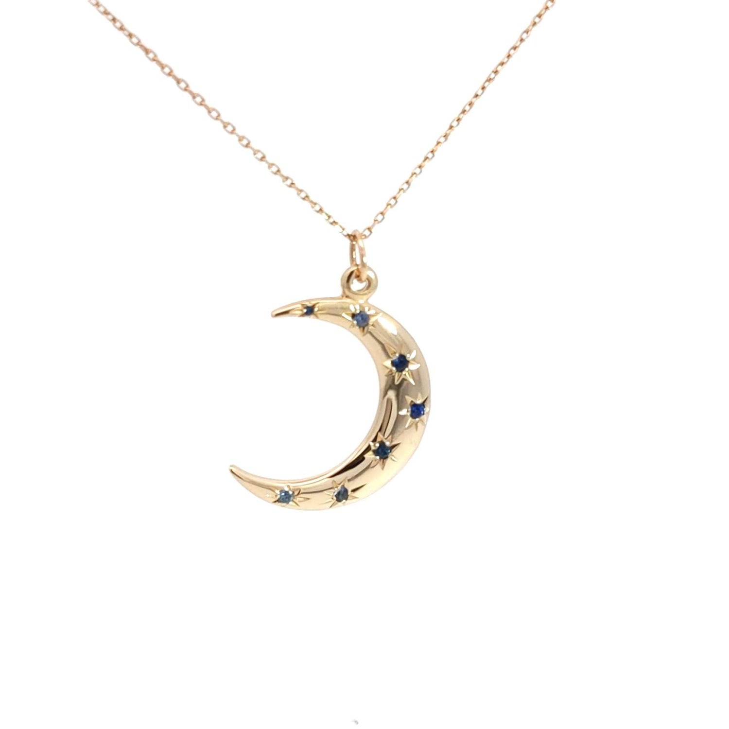 14K gold Crescent Moon Necklace with sapphire starburst accents on an 18-inch chain