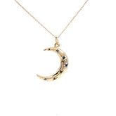 14K gold Crescent Moon Necklace with sapphire starburst accents on an 18-inch chain