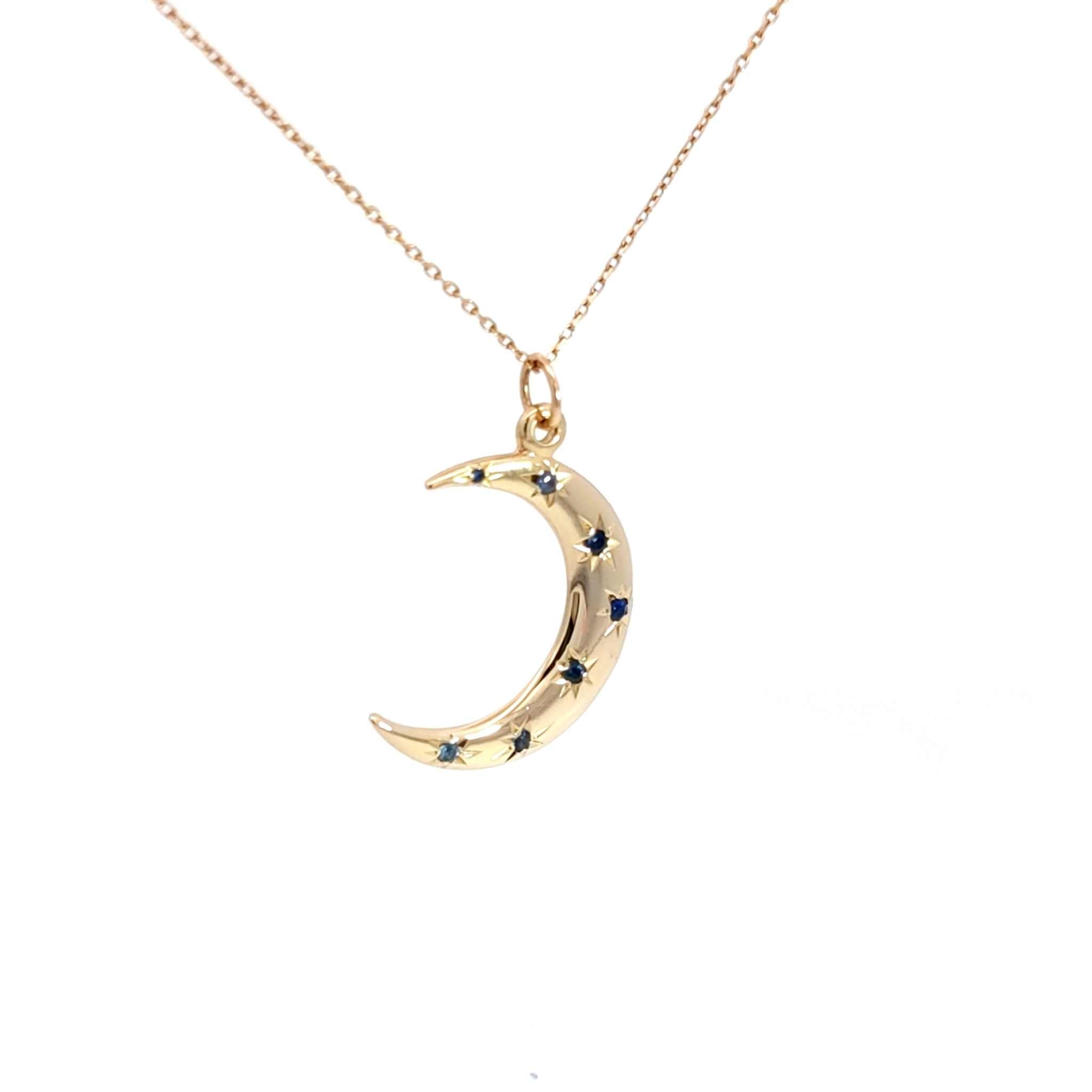14K gold crescent moon necklace with sapphire starburst accents on an 18-inch cable chain