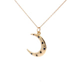 14K gold crescent moon necklace with sapphire starburst design on 18-inch chain
