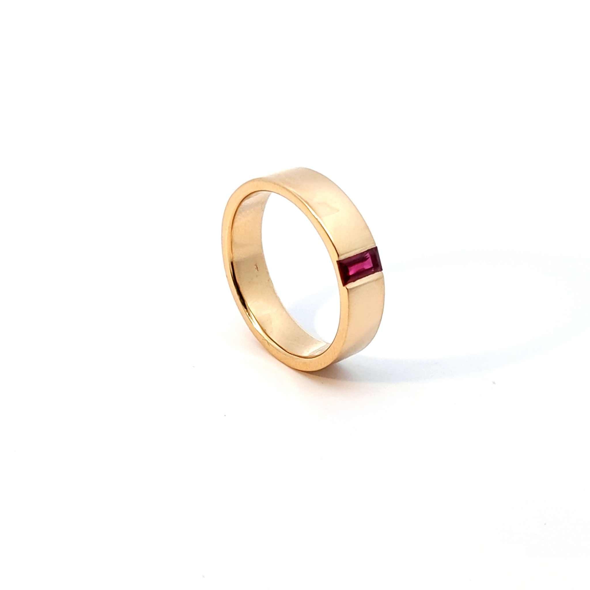 18K yellow gold Amory Band wedding ring with 0.47-carat channel-set baguette ruby and 6mm width