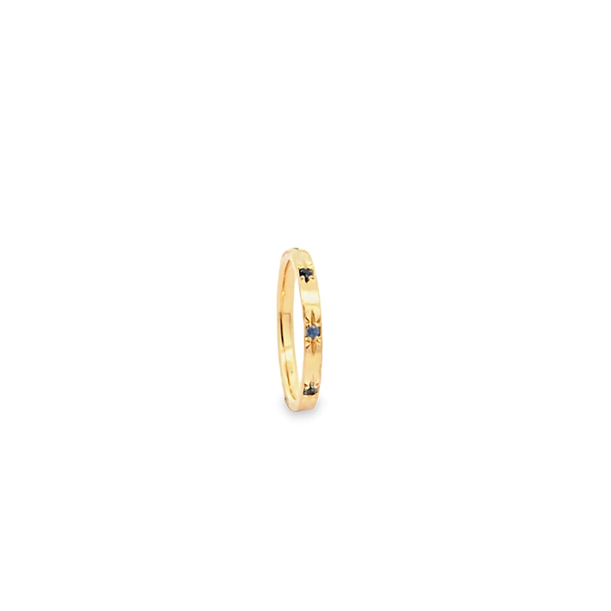 Solace Band 18K yellow gold ring with starburst design and blue sapphires, celestial-inspired jewelry