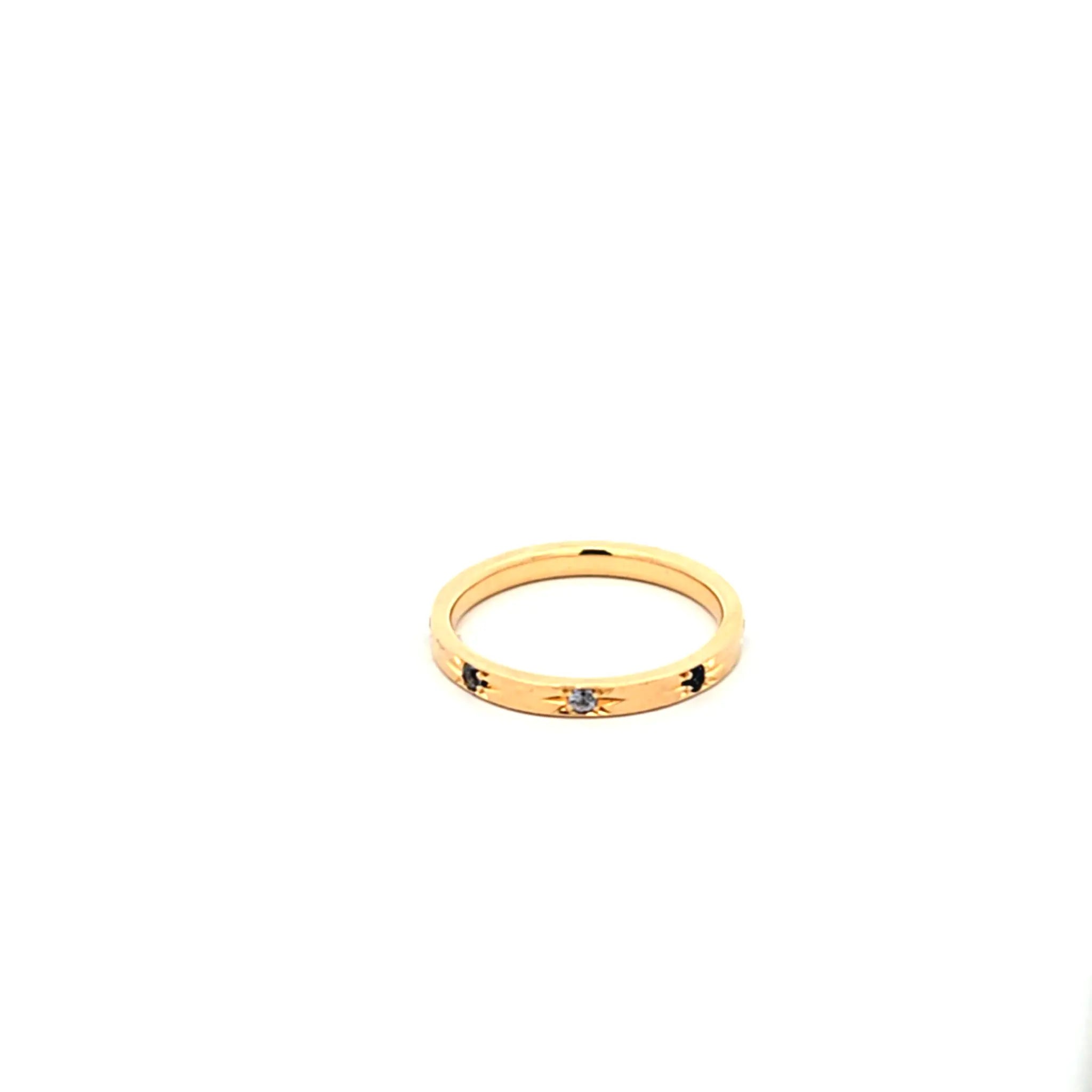 18K yellow gold Solace Band with starburst design and blue sapphires, inspired by night sky stars
