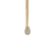 Close-up of 14k yellow gold Matchstick Necklace pendant with pave set diamonds on white background