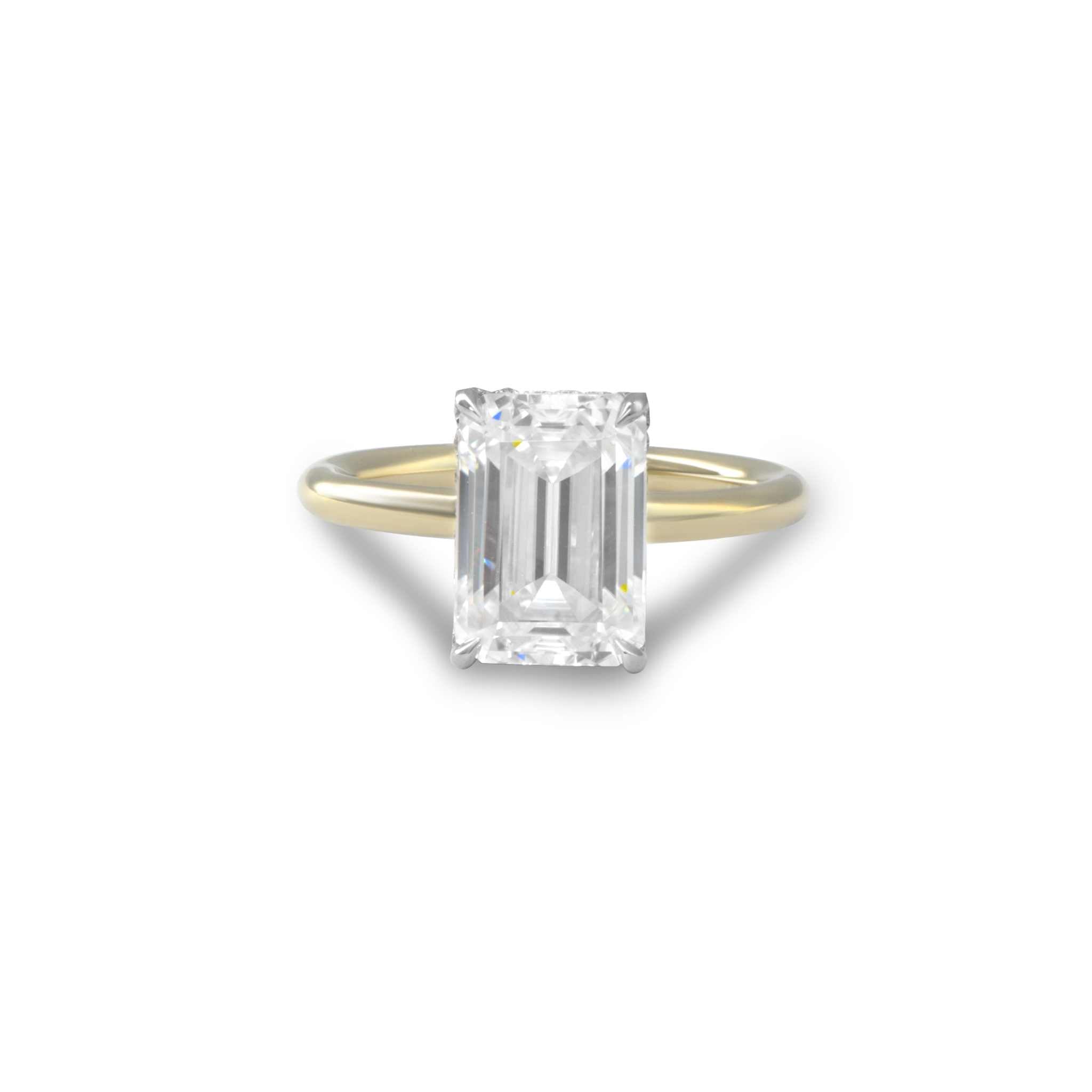 Esmeralda Solitaire Engagement Ring with emerald-cut diamond set in gold