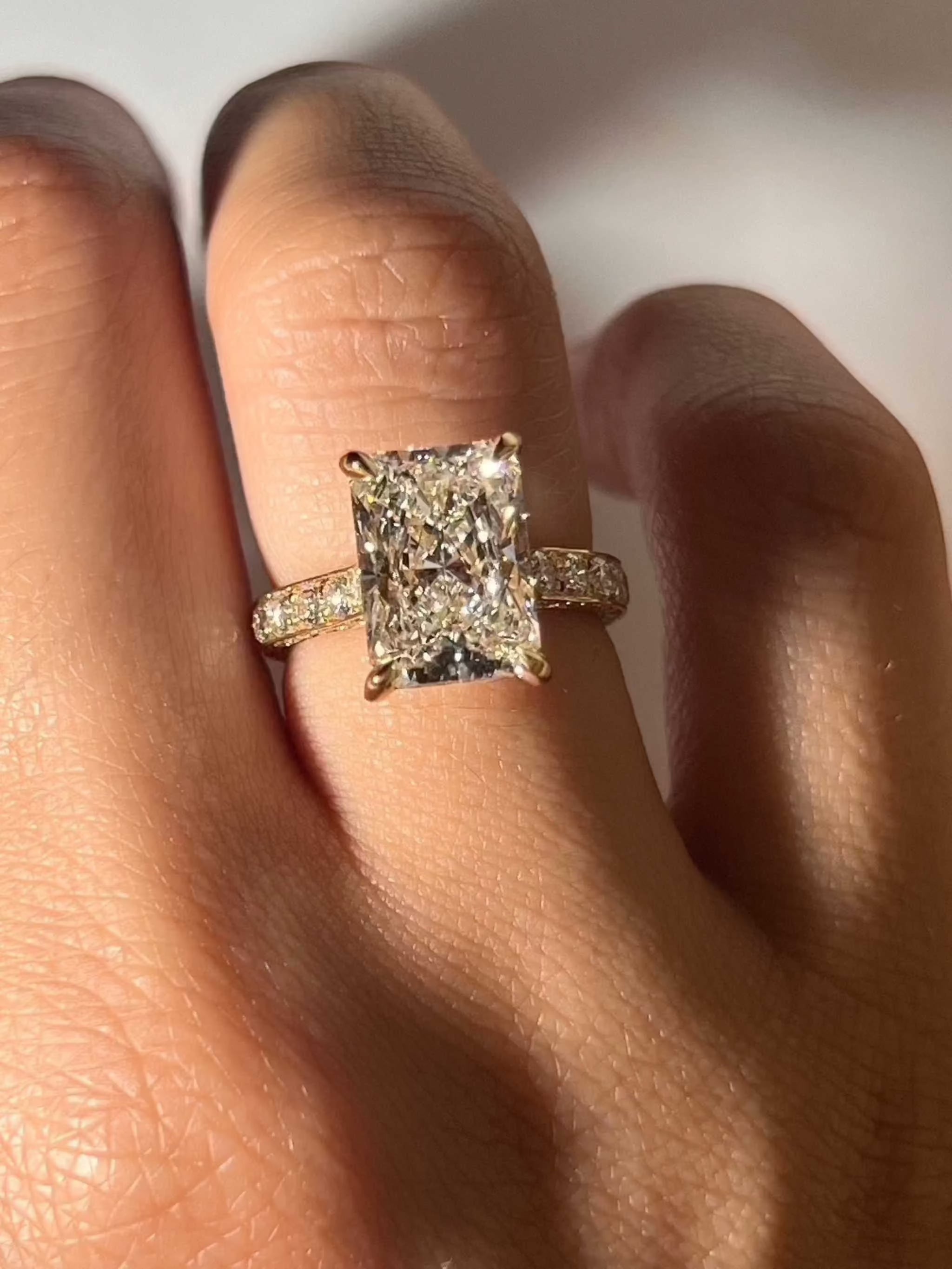 Juliana Engagement Ring radiant cut diamond with three-row pavé band on hand