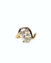 Lucia Engagement Ring with oval diamond and flowing wave-like gold shank, featuring a hidden halo of natural diamonds
