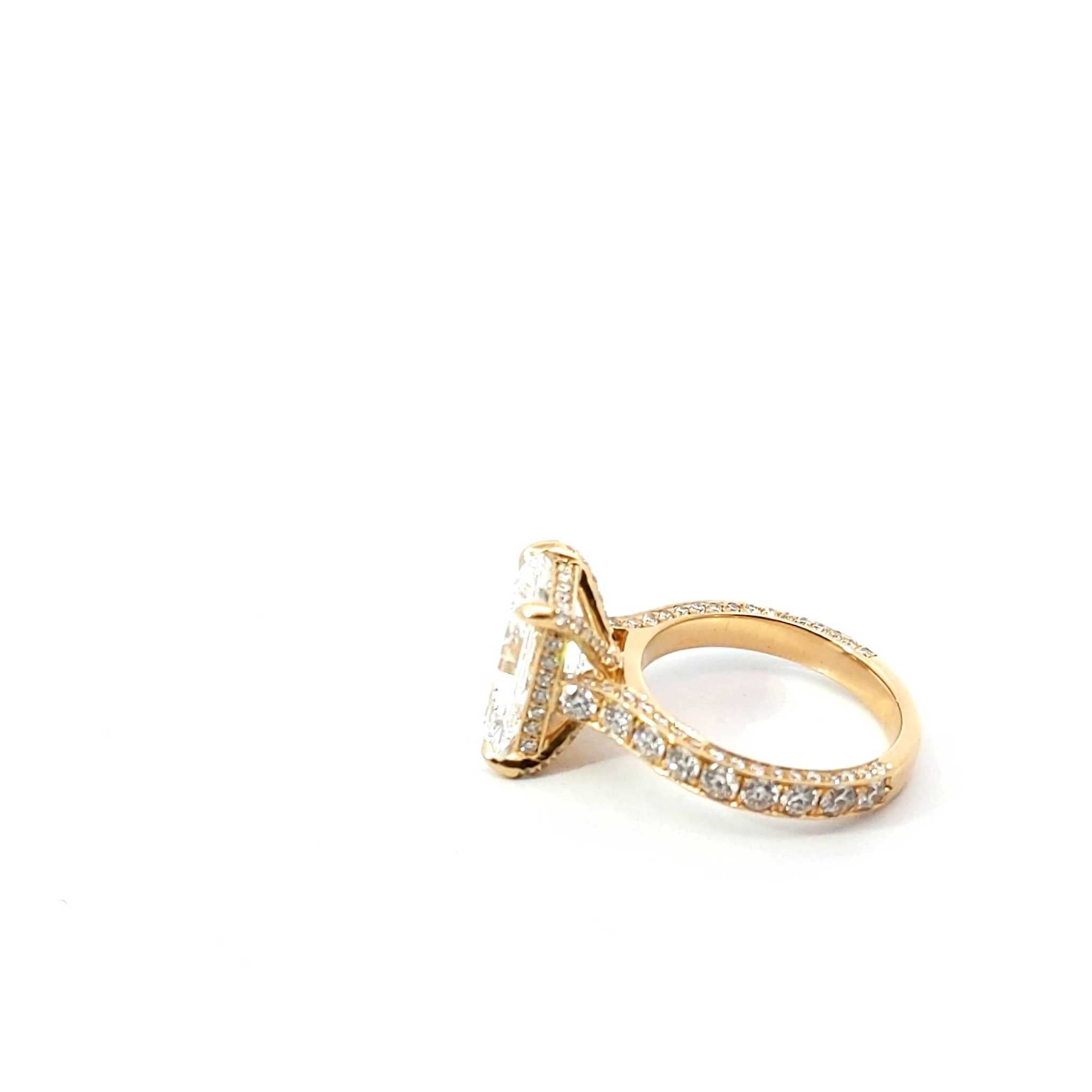 Juliana Engagement Ring with radiant cut diamond, 18K gold and platinum, hidden halo, diamond prongs, and three-row pavé band with 1.6 carats of EF VS diamonds.