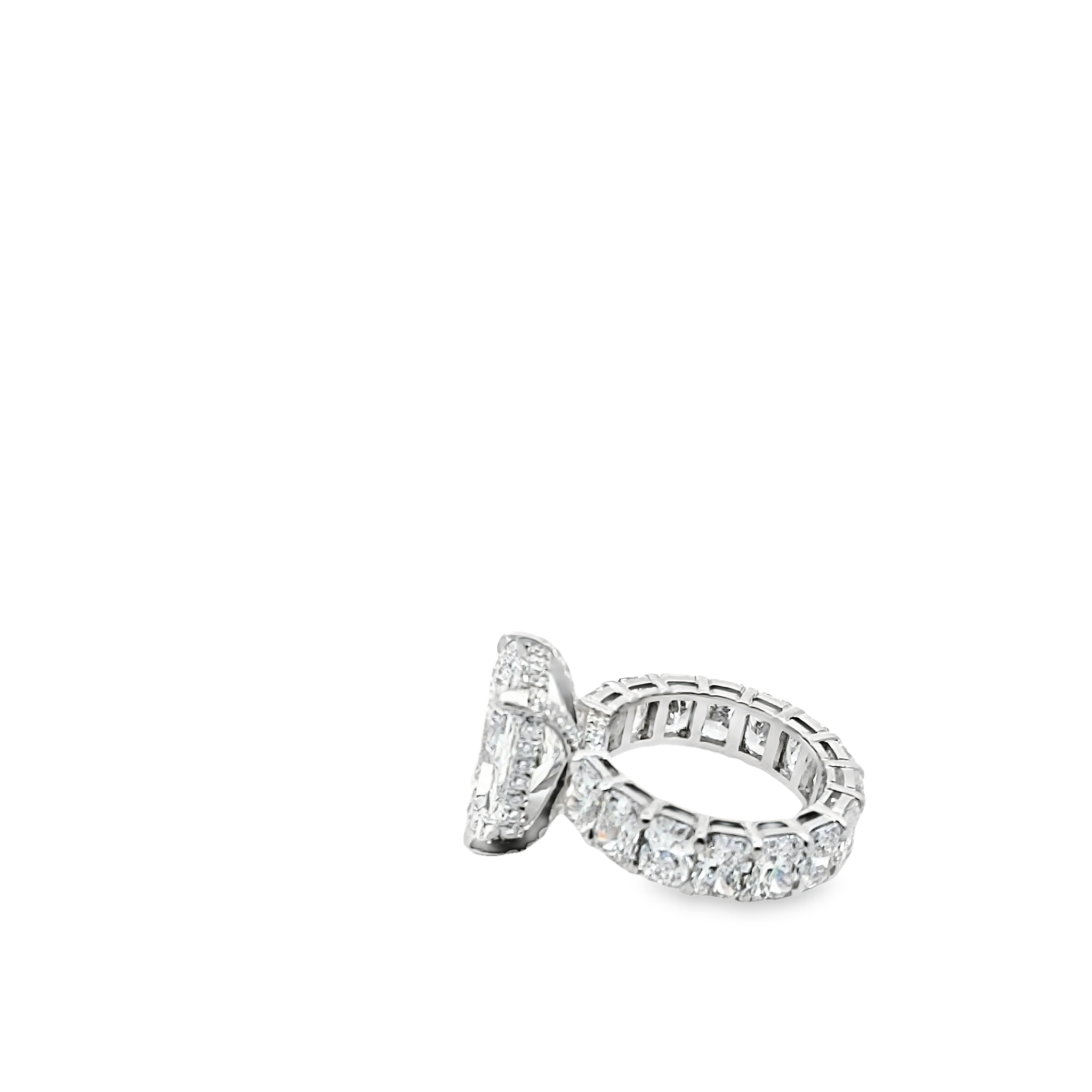 Aiden Engagement Ring featuring a radiant-cut center diamond with an eternity band of radiant-cut diamonds and a hidden halo setting