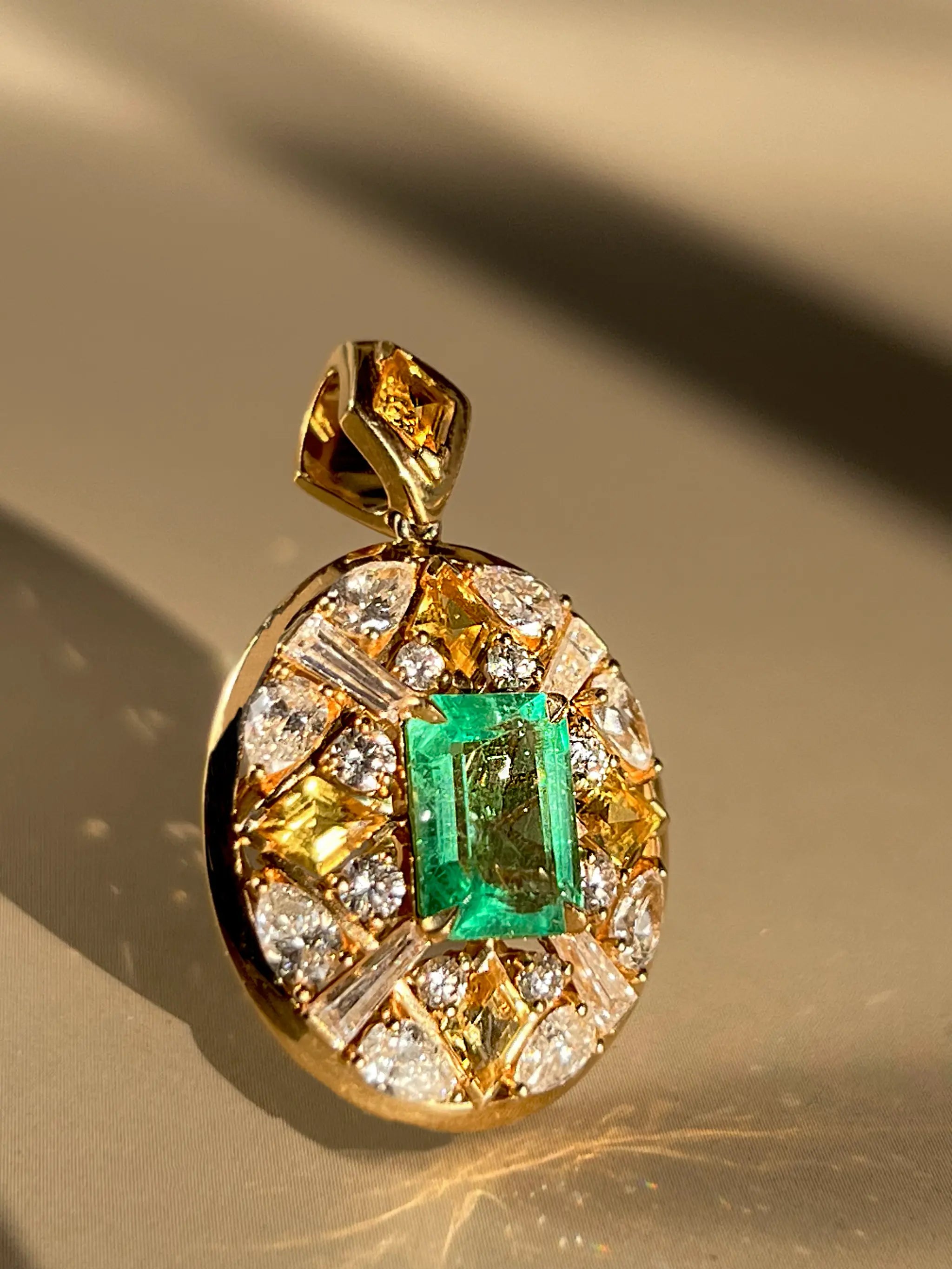Zia Necklace pendant with 1.59-carat emerald, yellow sapphires, and VS diamonds set in 18K yellow gold