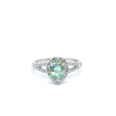 Gigi Alternative Engagement Ring with teal Paraiba Tourmaline center and diamond halo on silver band