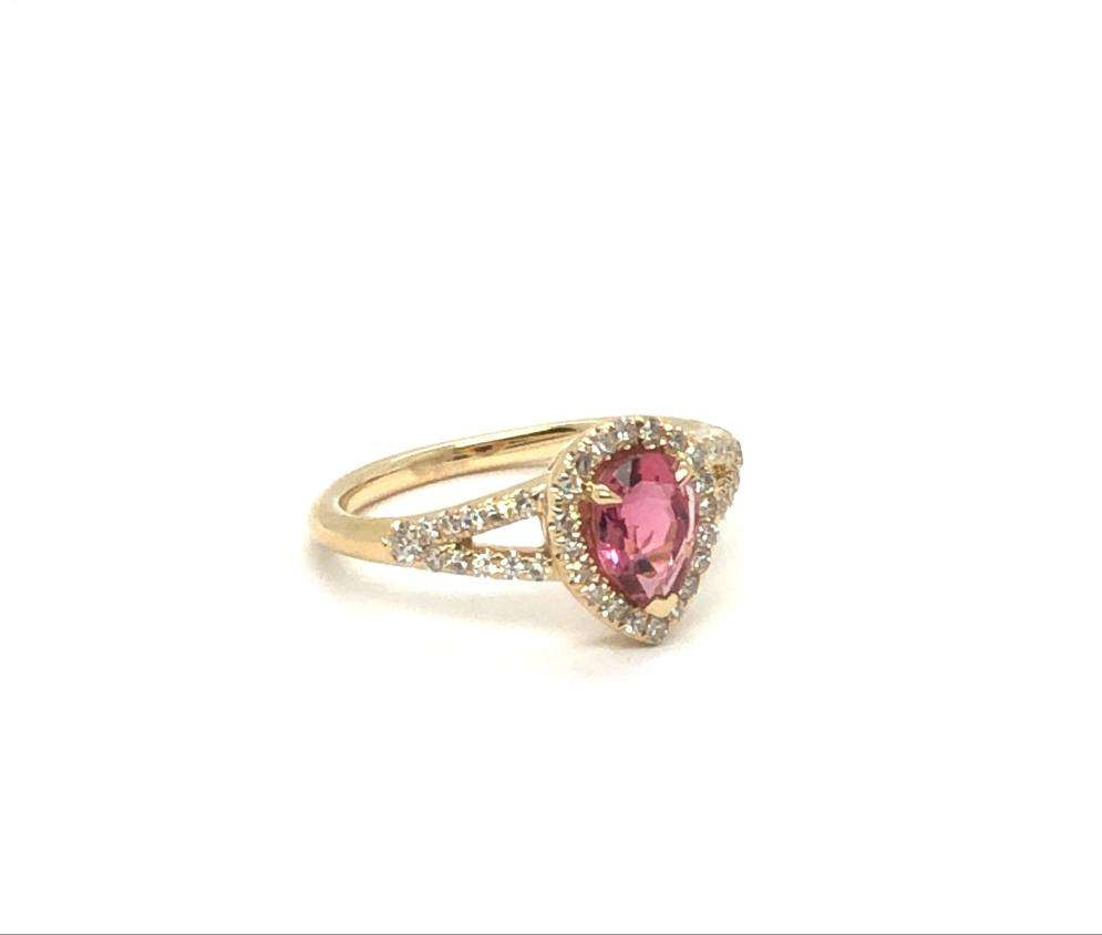 GiGi Alternative Engagement Ring with pink tourmaline center and diamond halo on gold band
