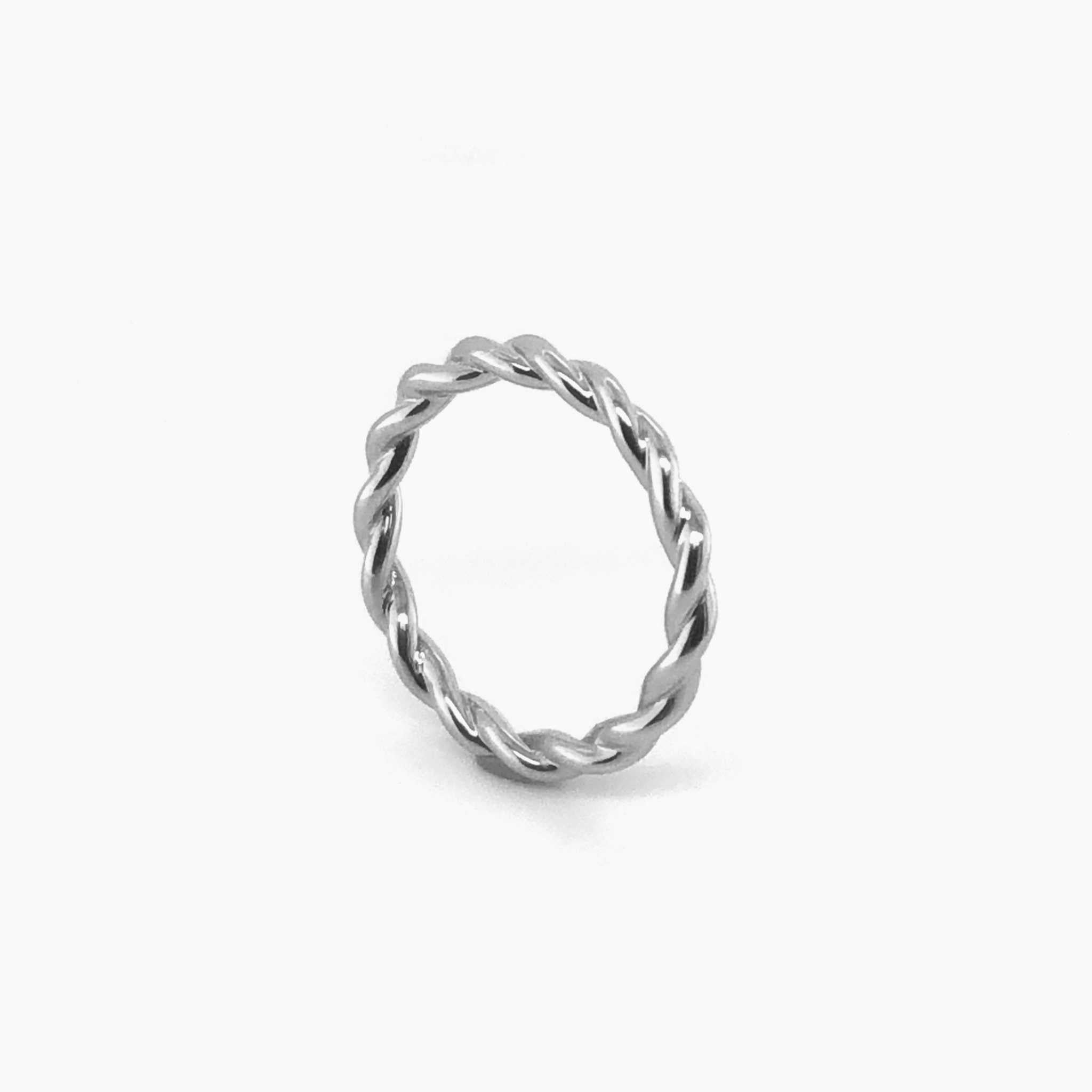 Eva Wedding Band twisted design in white gold on white background