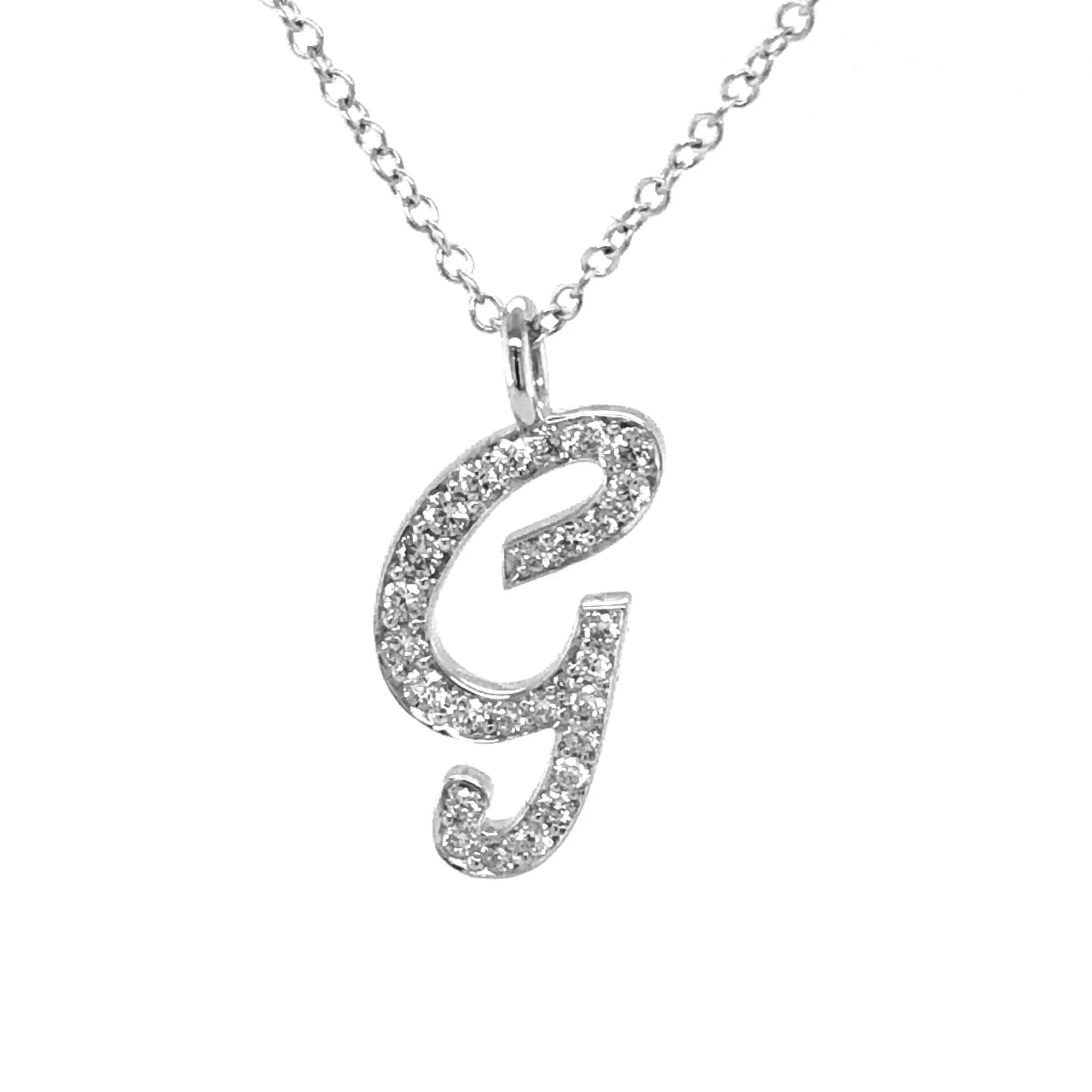 Diamond initial necklace pendant with pavé diamonds on silver chain