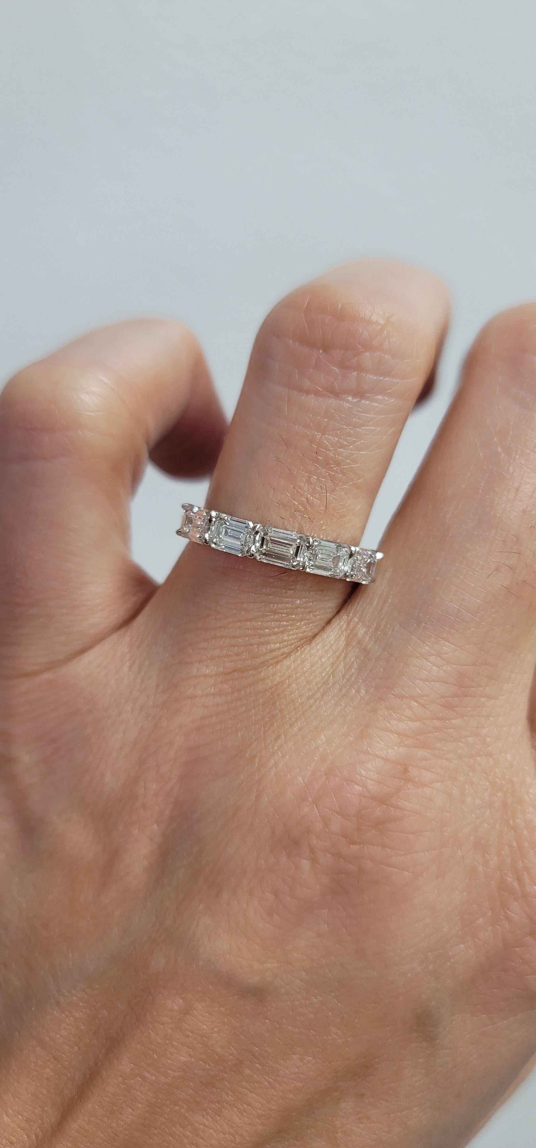 Delilah 5 Stone Anniversary Band platinum ring with five emerald cut diamonds on hand