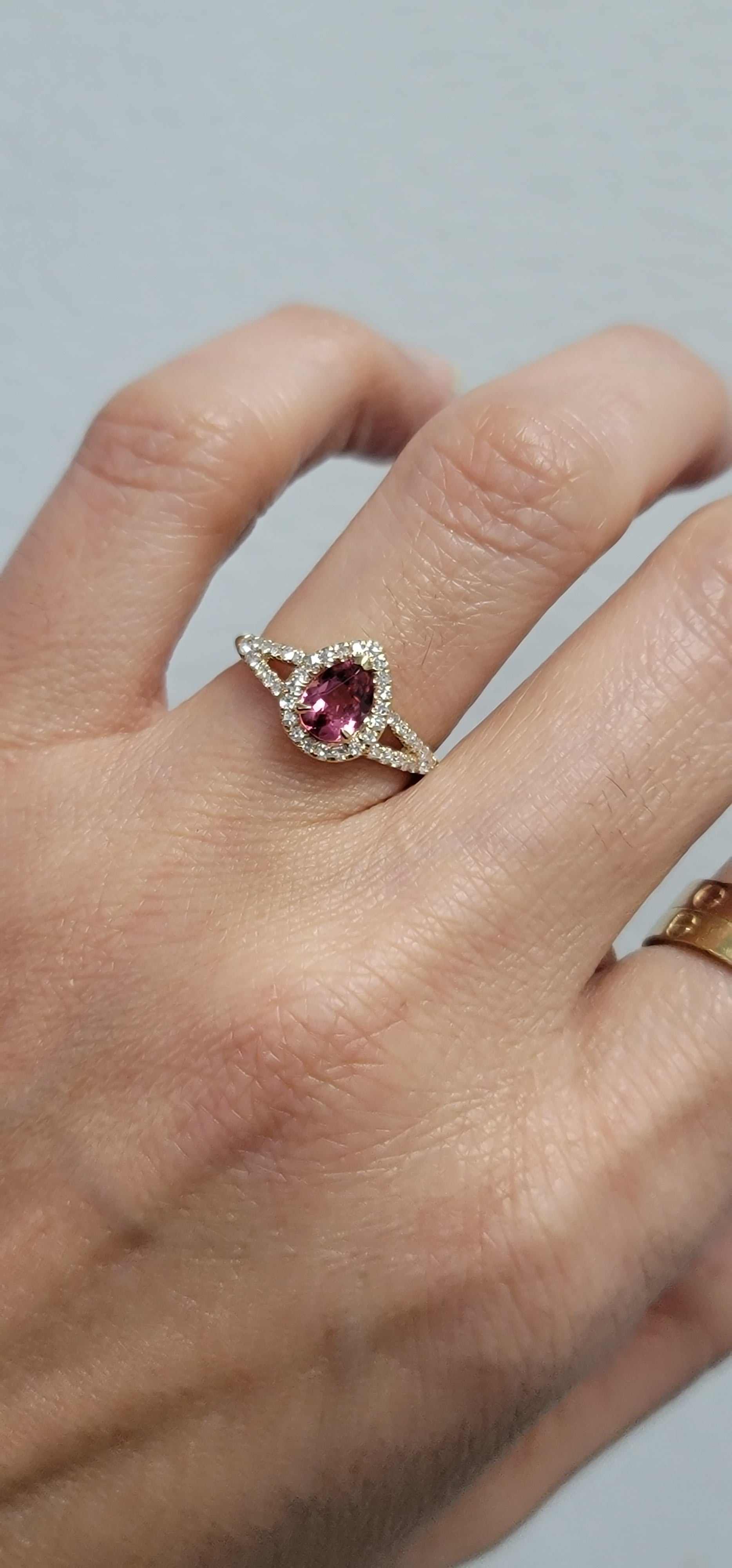 GiGi Alternative Engagement Ring with vibrant pink tourmaline center stone and natural diamonds on hand