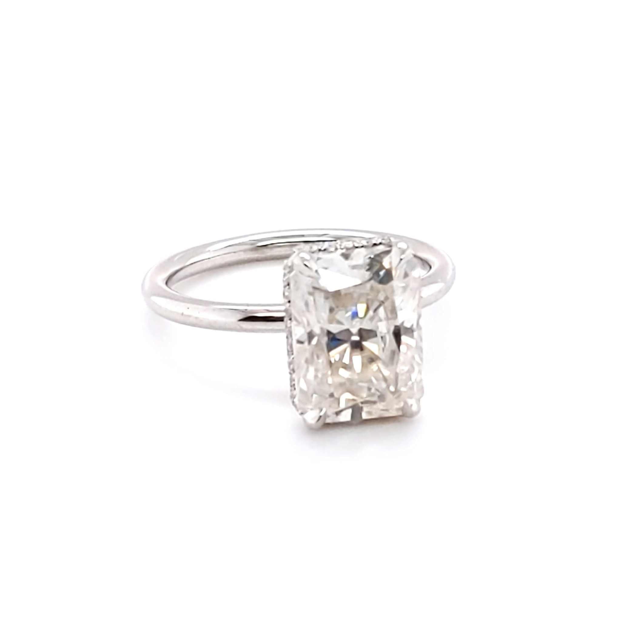 Mimi Hidden Halo Engagement Ring with 4ct radiant cut diamond and hidden halo setting on sleek band