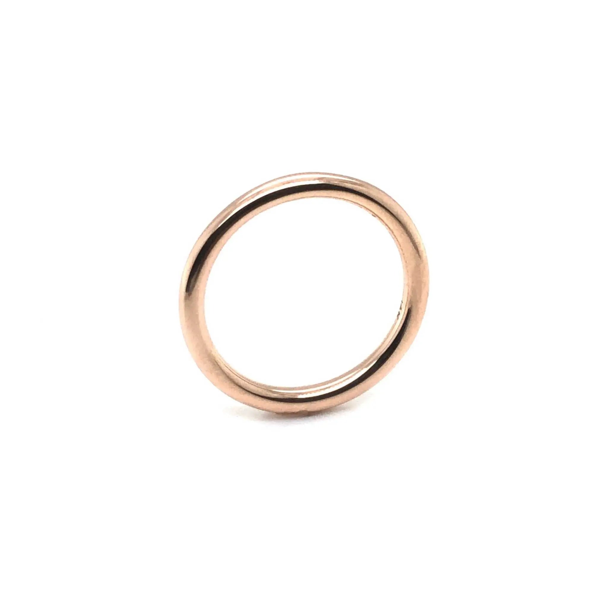Simple polished 18K gold Maxi Wedding Band with 2.3mm round profile against white background
