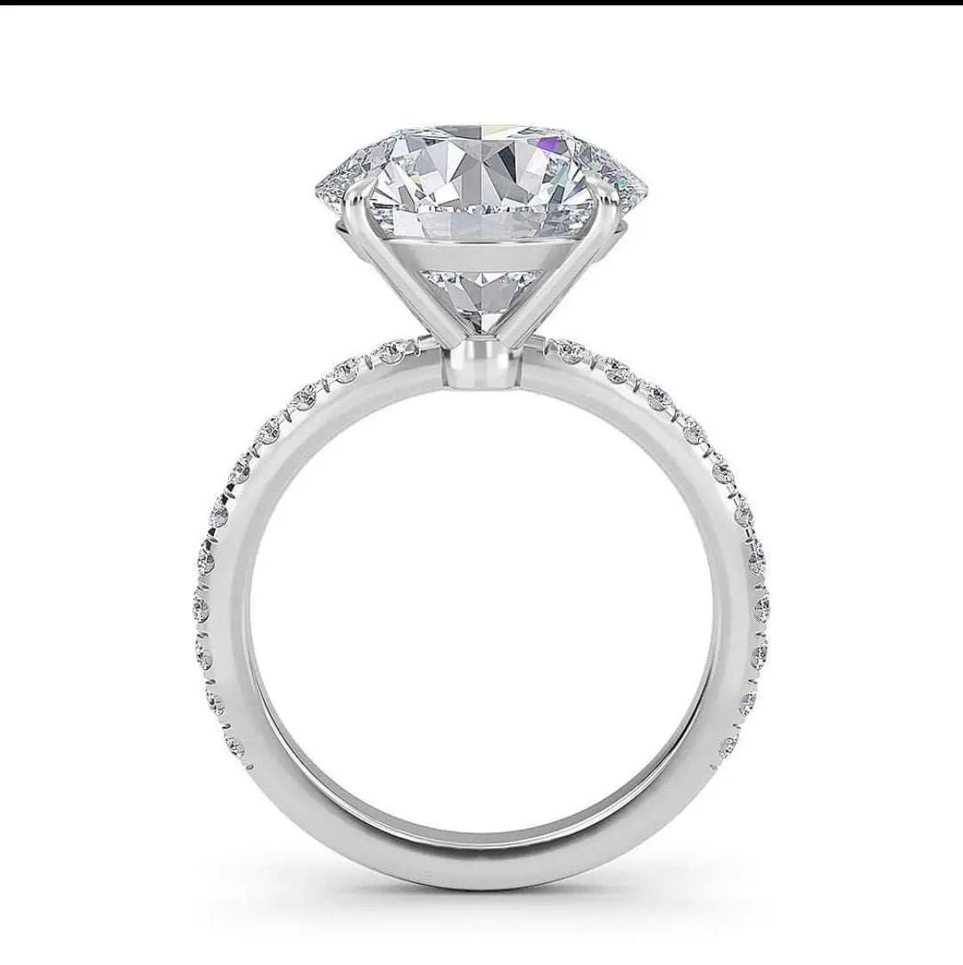 Ora Engagement Ring in platinum with VS center diamond and surrounding F VS1 accent diamonds