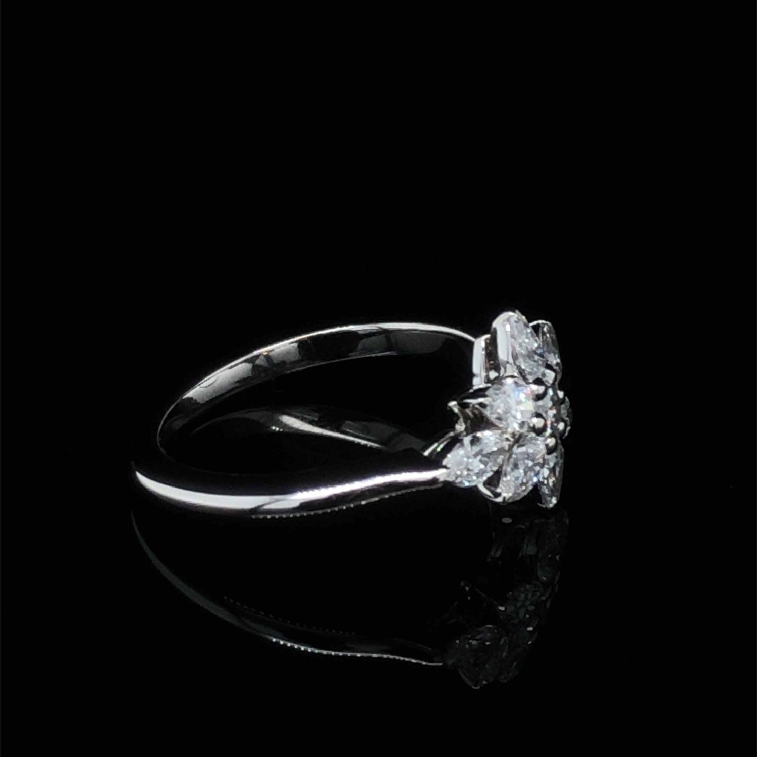 Daisy Engagement Ring with pear, marquise, and round FG VS1 diamonds in platinum knife-edge setting
