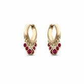 Pair of Nina Hoop earrings in 18K gold with bezel-set diamond-cut rubies totaling 0.65ct