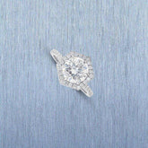 Ilana Double Edge Halo Engagement Ring with 3 carat lab grown brilliant cut diamond and halo setting on textured blue background