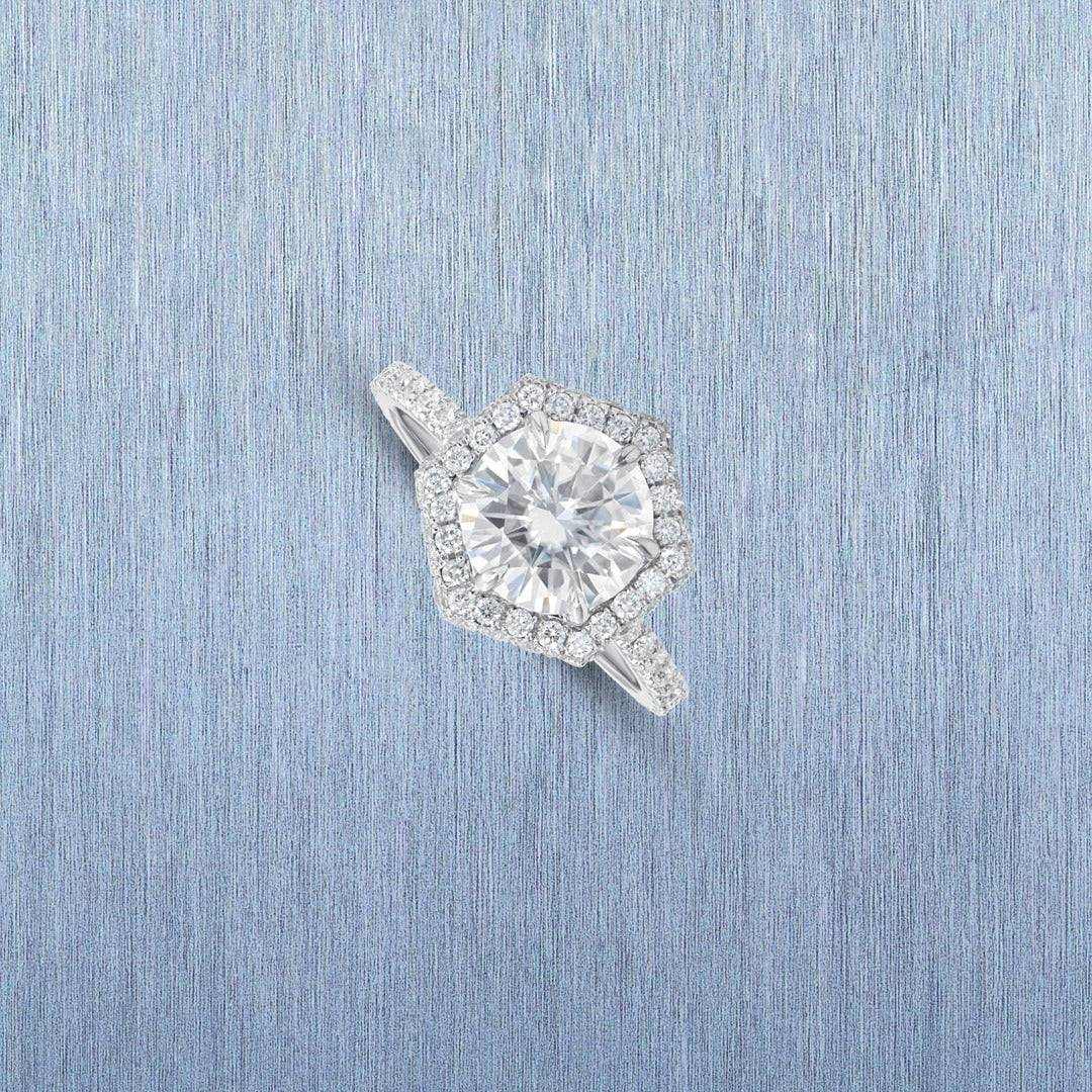 Ilana Double Edge Halo Engagement Ring with 3 carat lab grown brilliant cut diamond and halo setting on textured blue background