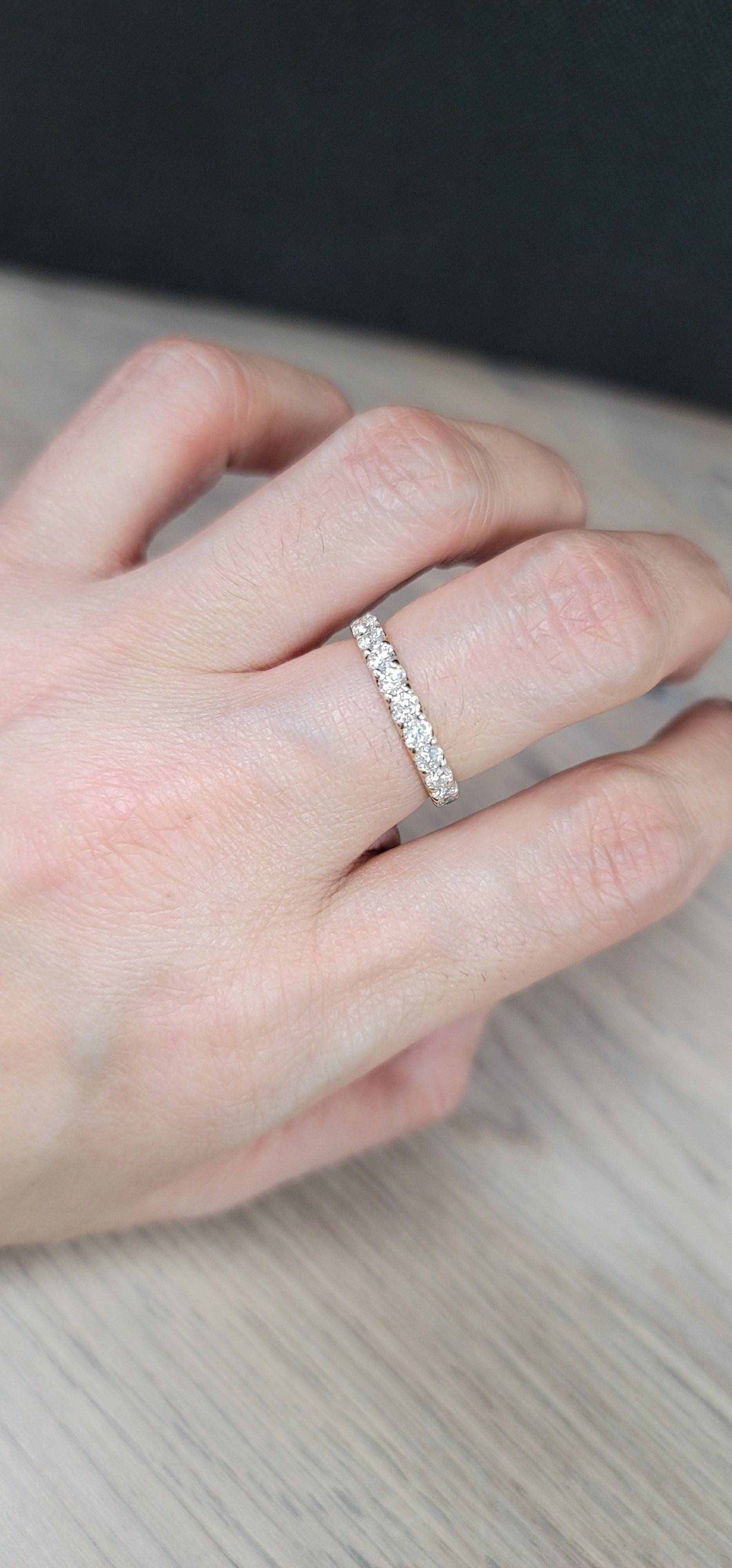 Mona Diamond Wedding Band in 18K yellow gold with sparkling diamonds on finger