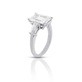 Meira three stone engagement ring with 2-carat emerald-cut diamond and 1.01 carats FG VS baguette diamonds in a silver band