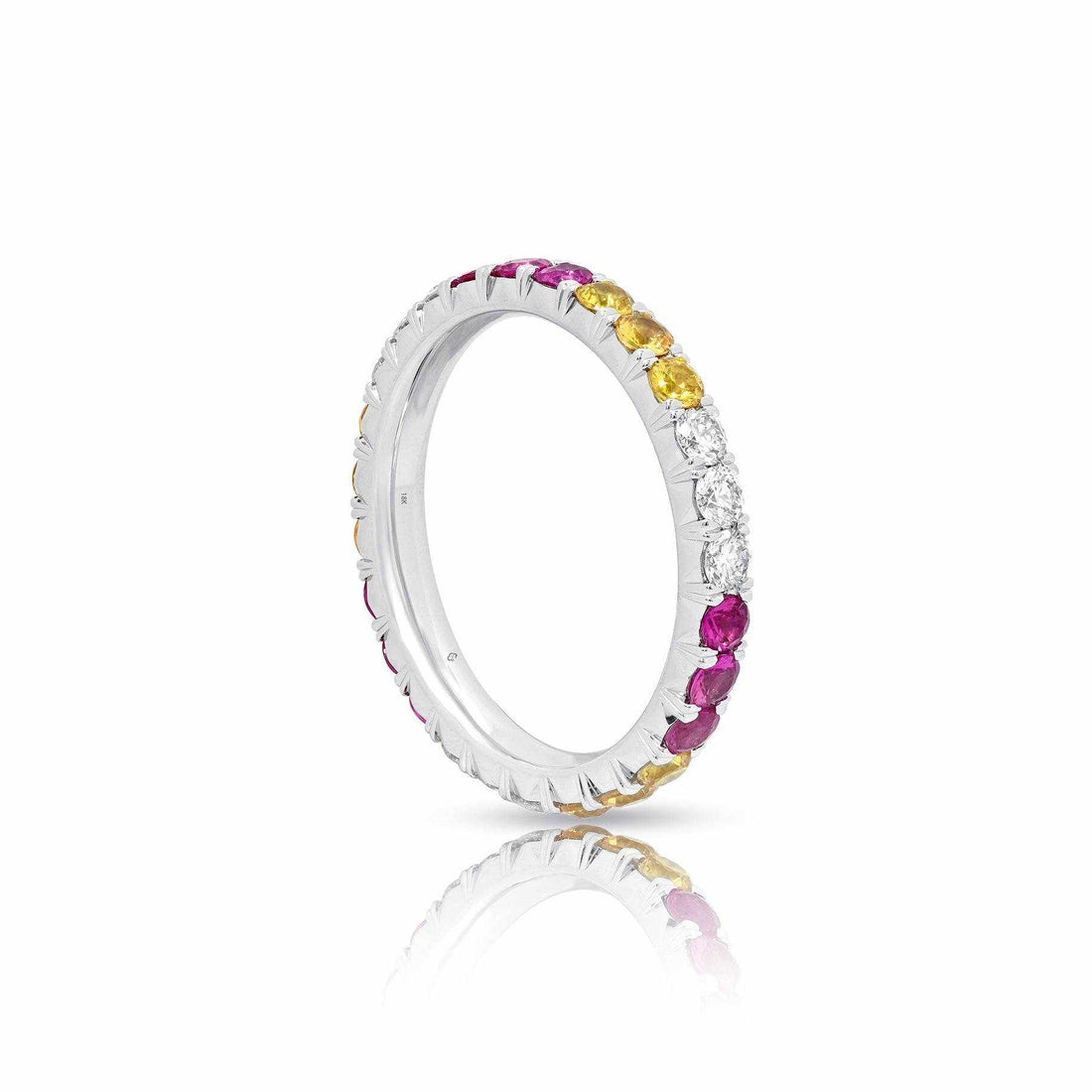 platinum eternity band with alternating sapphires, diamonds, and yellow gemstones
