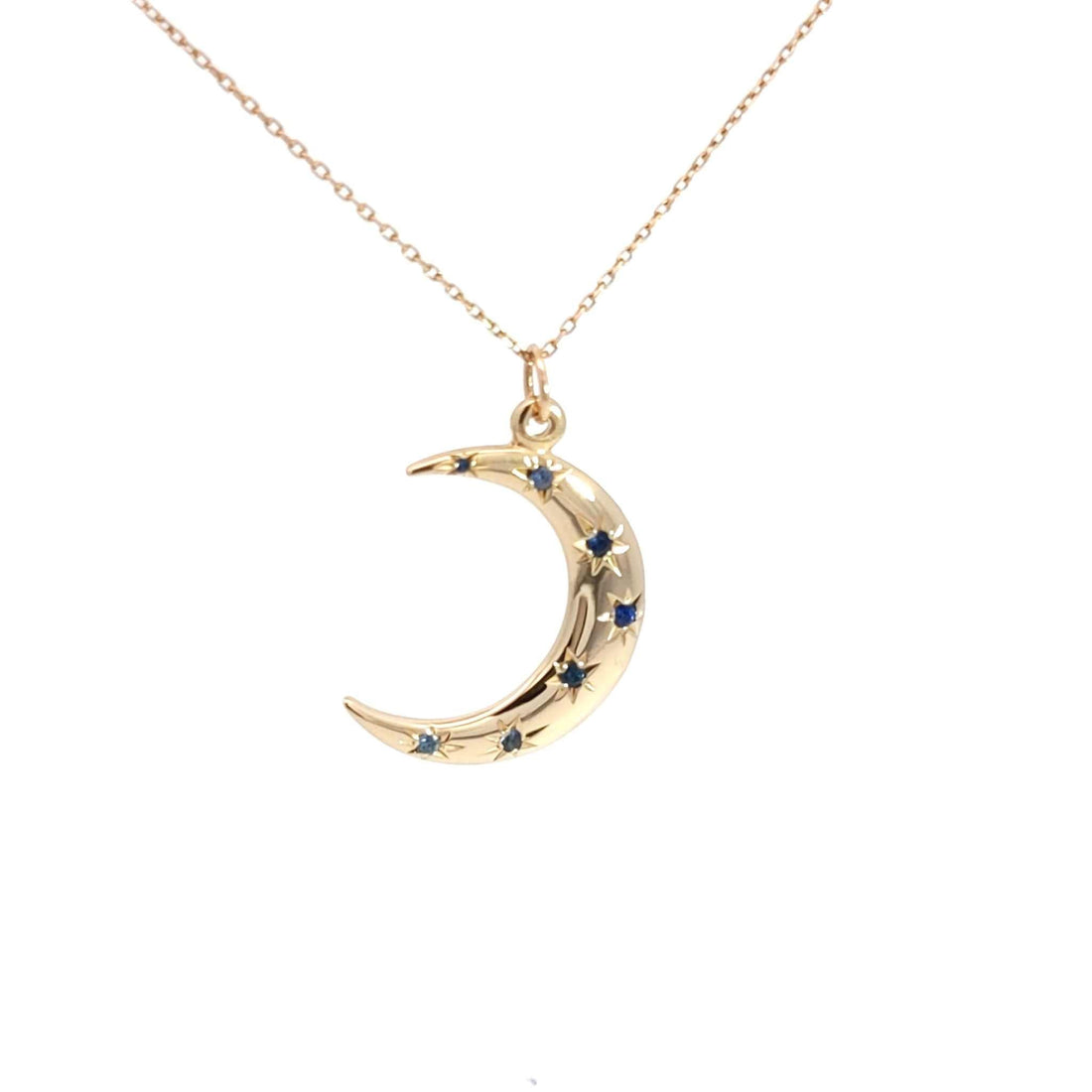 14K gold Crescent Moon Necklace with sapphire starburst accents on an 18-inch chain