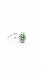 Jessica Alternative Engagement Ring with green tourmaline center and diamond halo in 18K yellow gold
