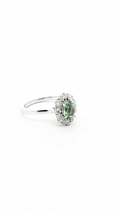 Jessica Alternative Engagement Ring with green tourmaline center and diamond halo in 18K yellow gold