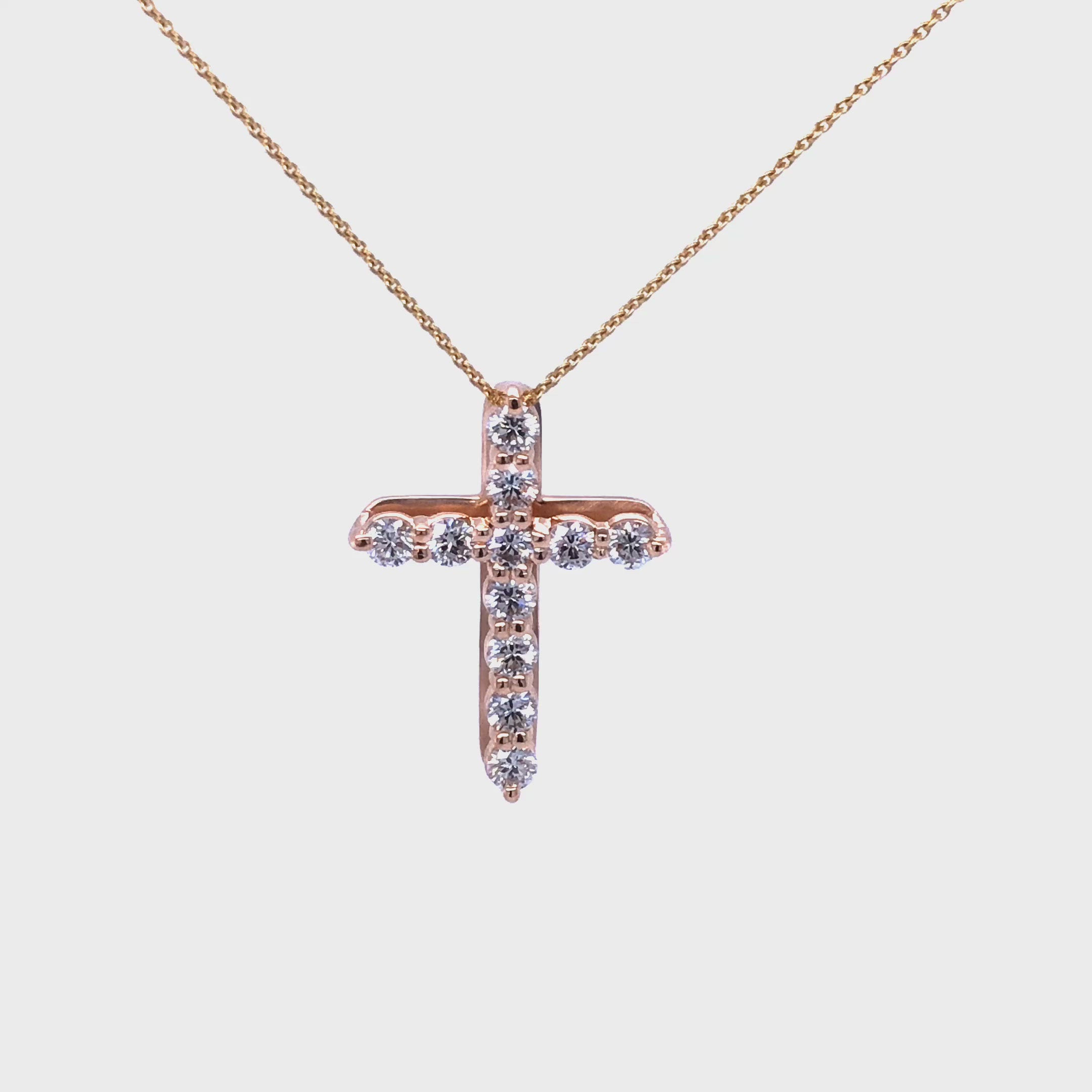 18k gold cross set with FG VS1 diamonds approximate total carat weight 0.68 on a 18 inch with 16 inch extension 18k gold cable chain